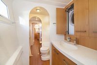 Master ensuite in starboard hull with washing machine